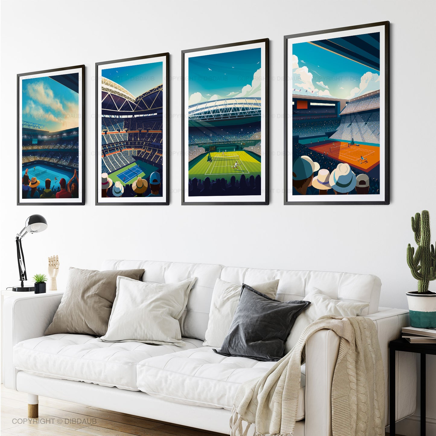 Four framed artworks of tennis stadiums on a wall above a white sofa.