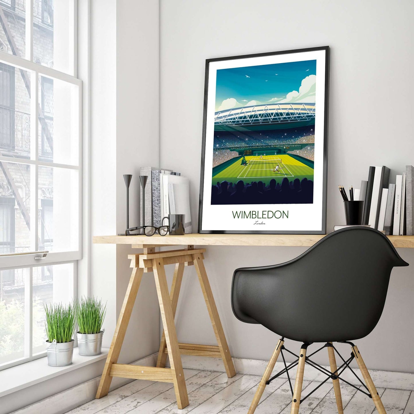 Tennis themed home office displaying a large print of Wimbledon centre court in a black frame, placed on a trestle desk.