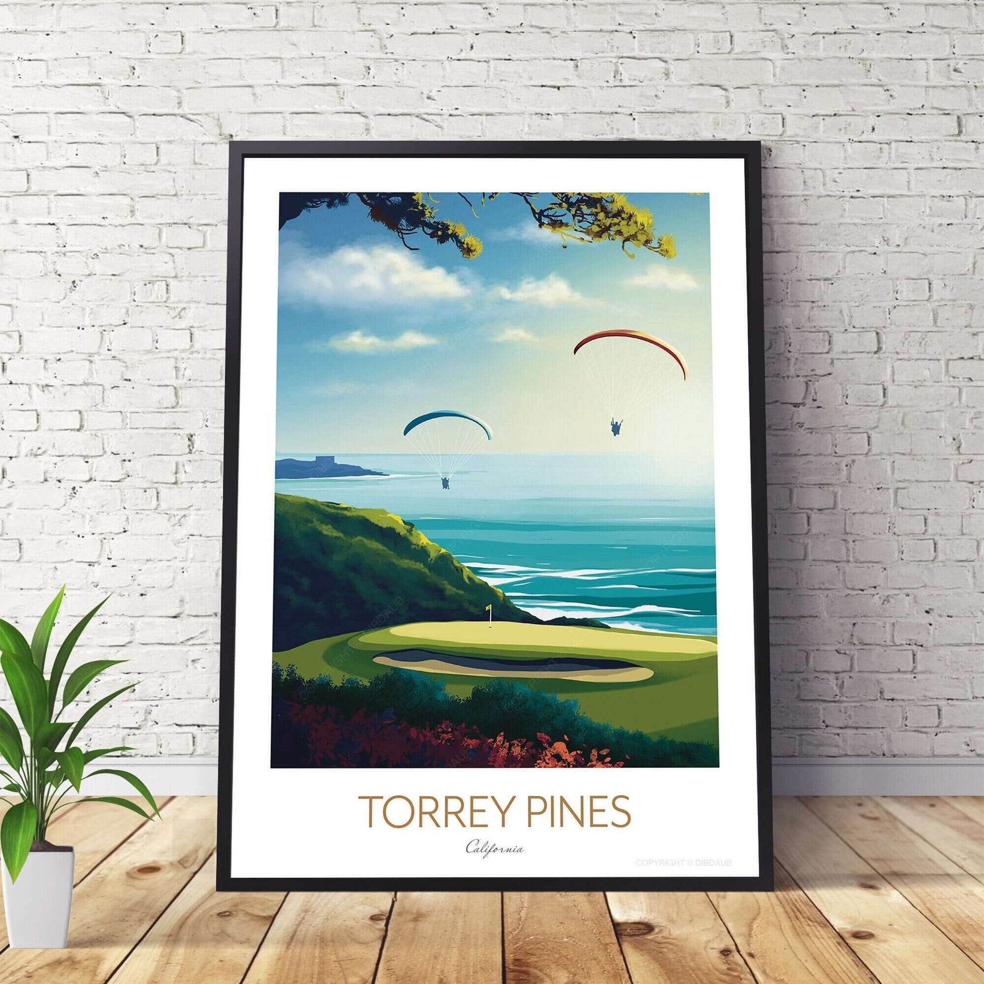 Golf print of Torrey Pines, in a black frame sitting against a wall on a wooden floor.