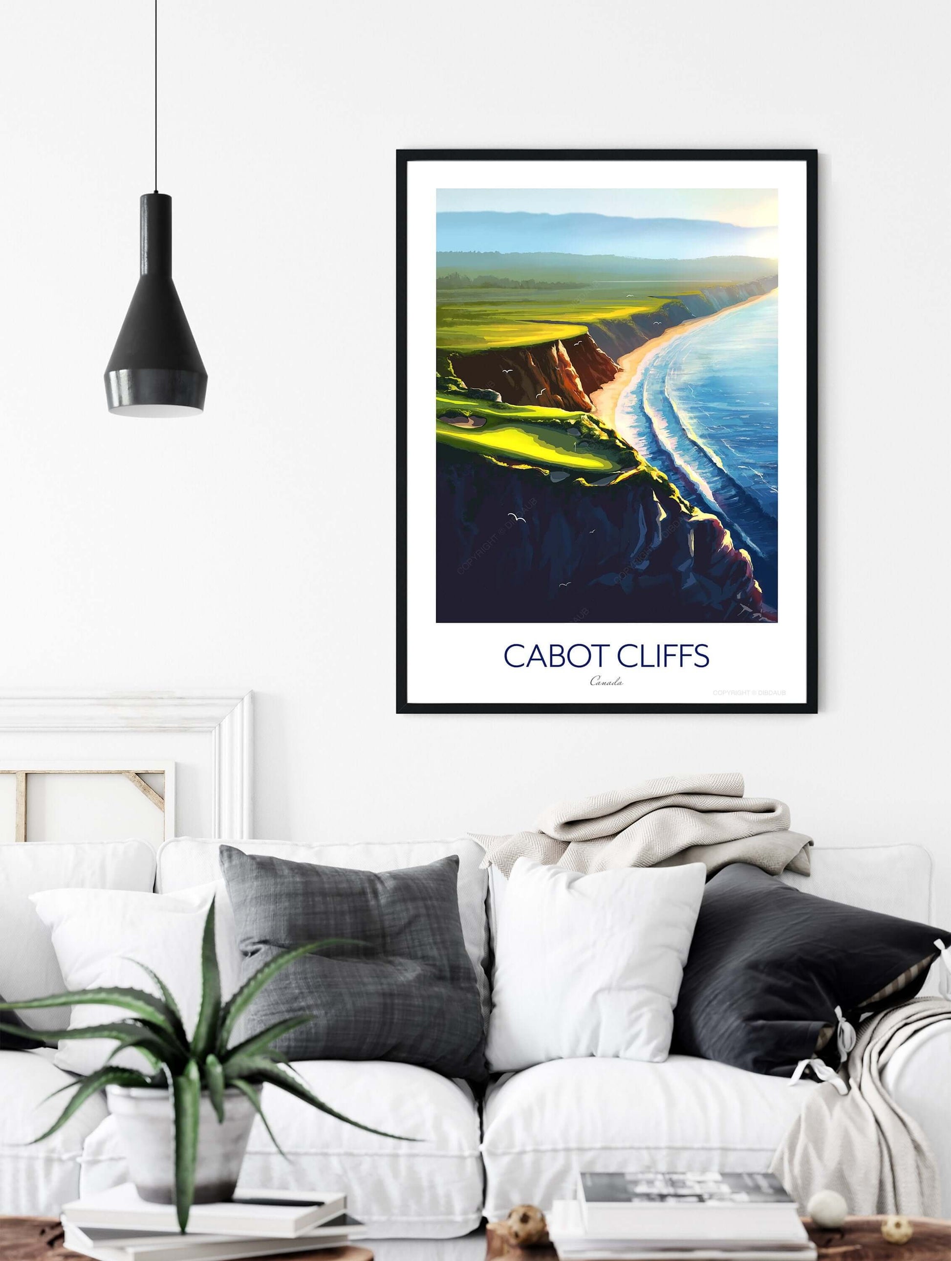 Golf print of Cabot Cliffs in a black frame above a sofa in a living room.