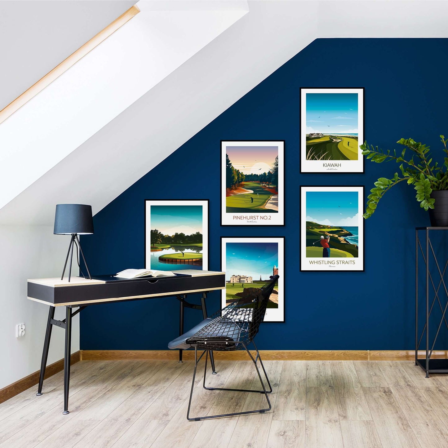 A home office with framed golf course art prints displayed on a dark blue feature wall, behind a desk.