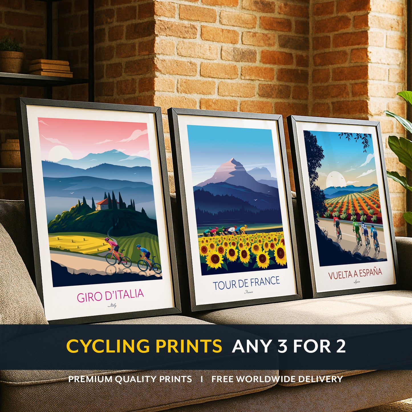 Three framed cycling prints on a couch with a brick wall background