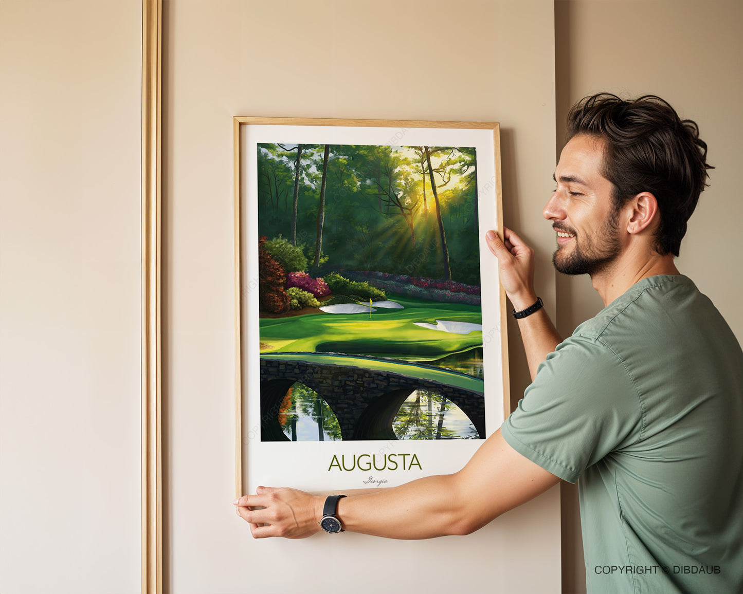 Man holding a framed picture of Augusta golf course.