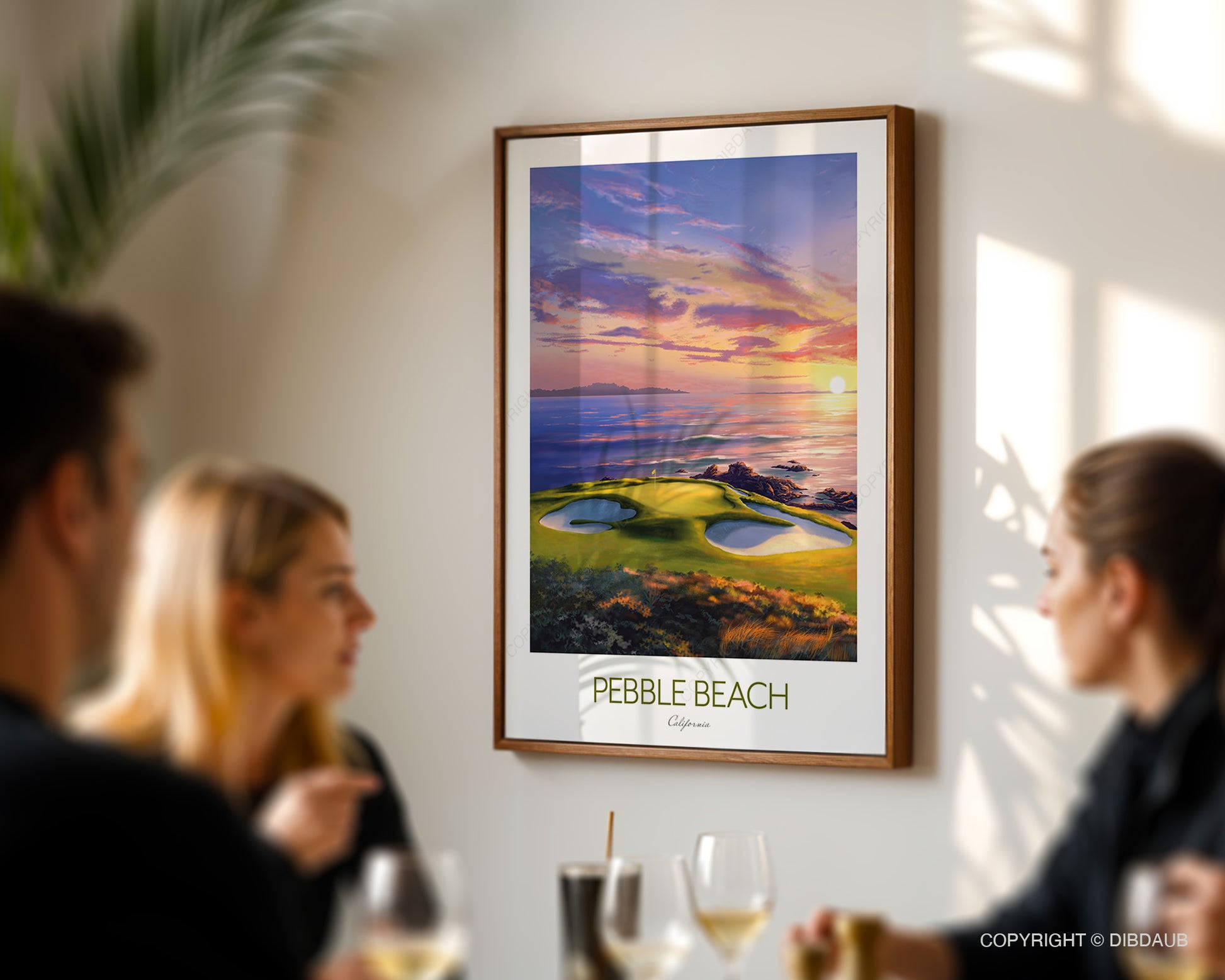 Framed artwork of Pebble Beach golf course 7th hole on a wall with people in the foreground. 
