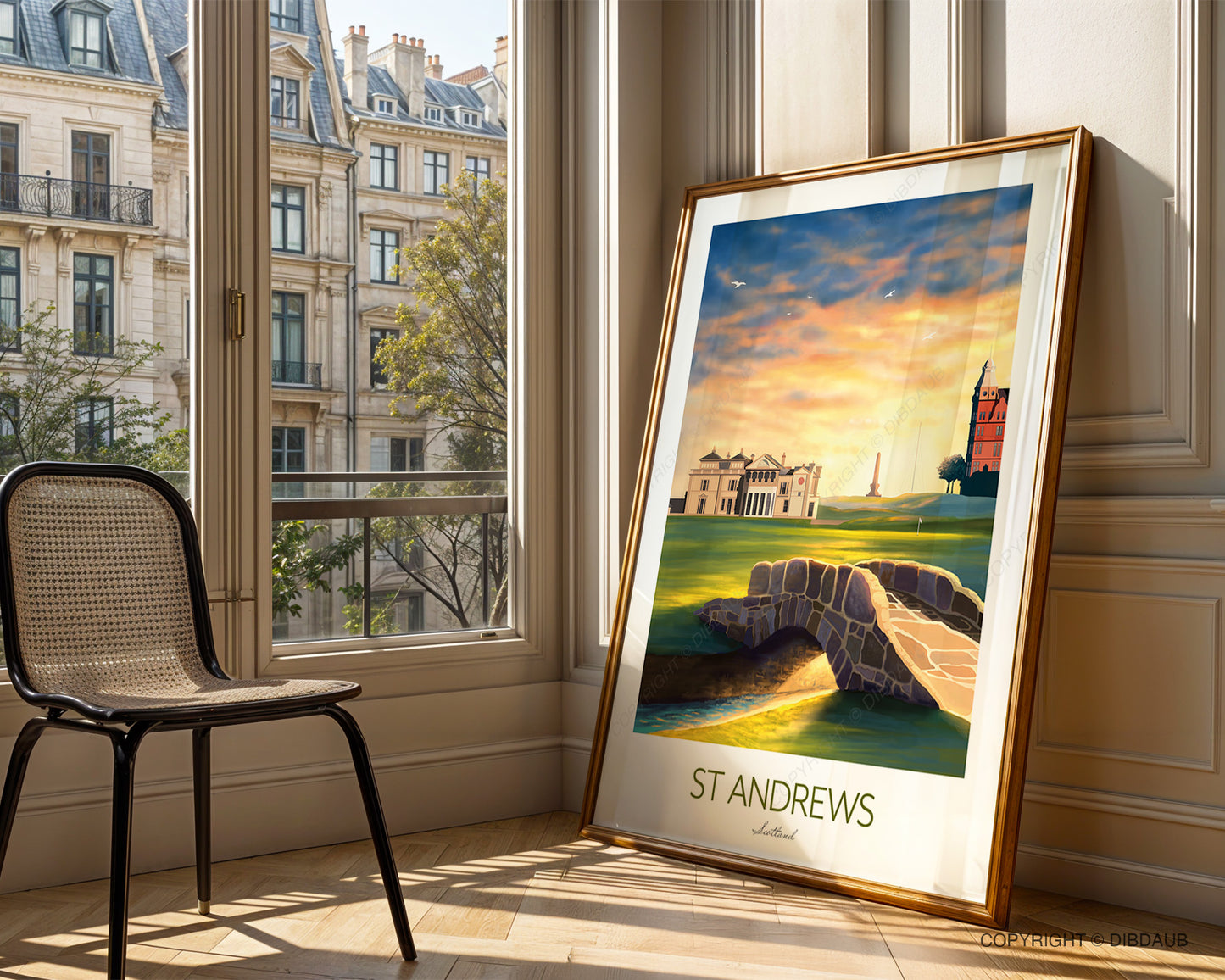 Detailed St Andrews wall art showing the famous 18th fairway glowing in golden sunset light. The golf print is framed and resting against the wall beside a window.