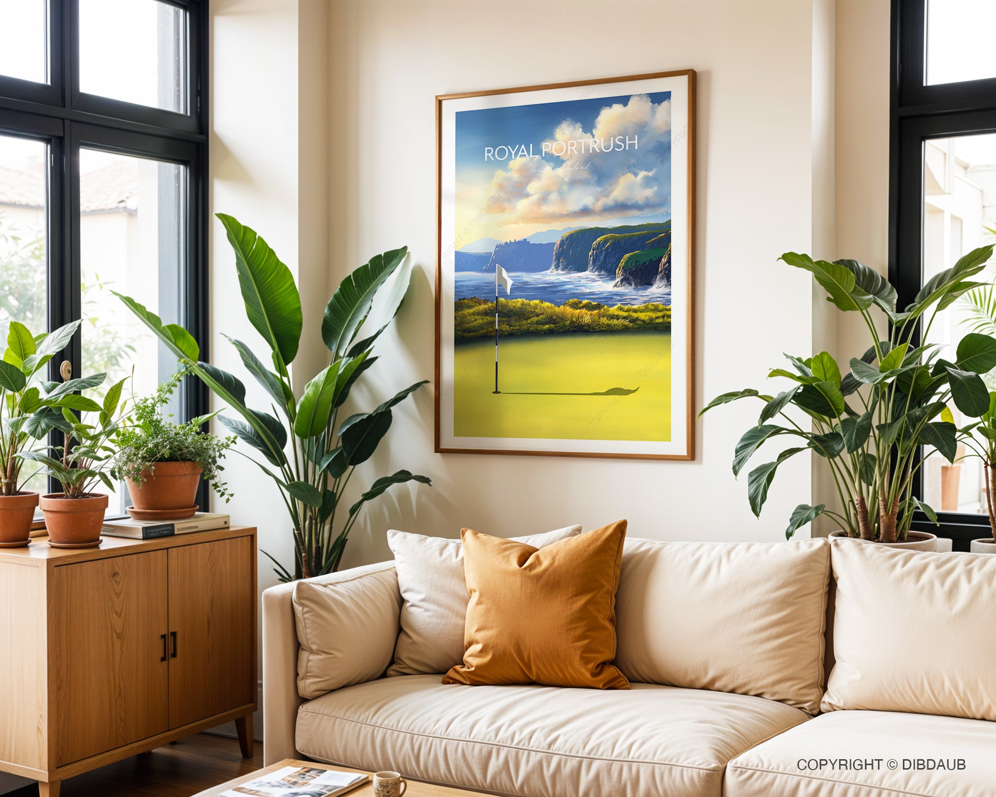 Living room with a beige sofa, decorative pillows, and framed golf wall art of Royal Portrush.