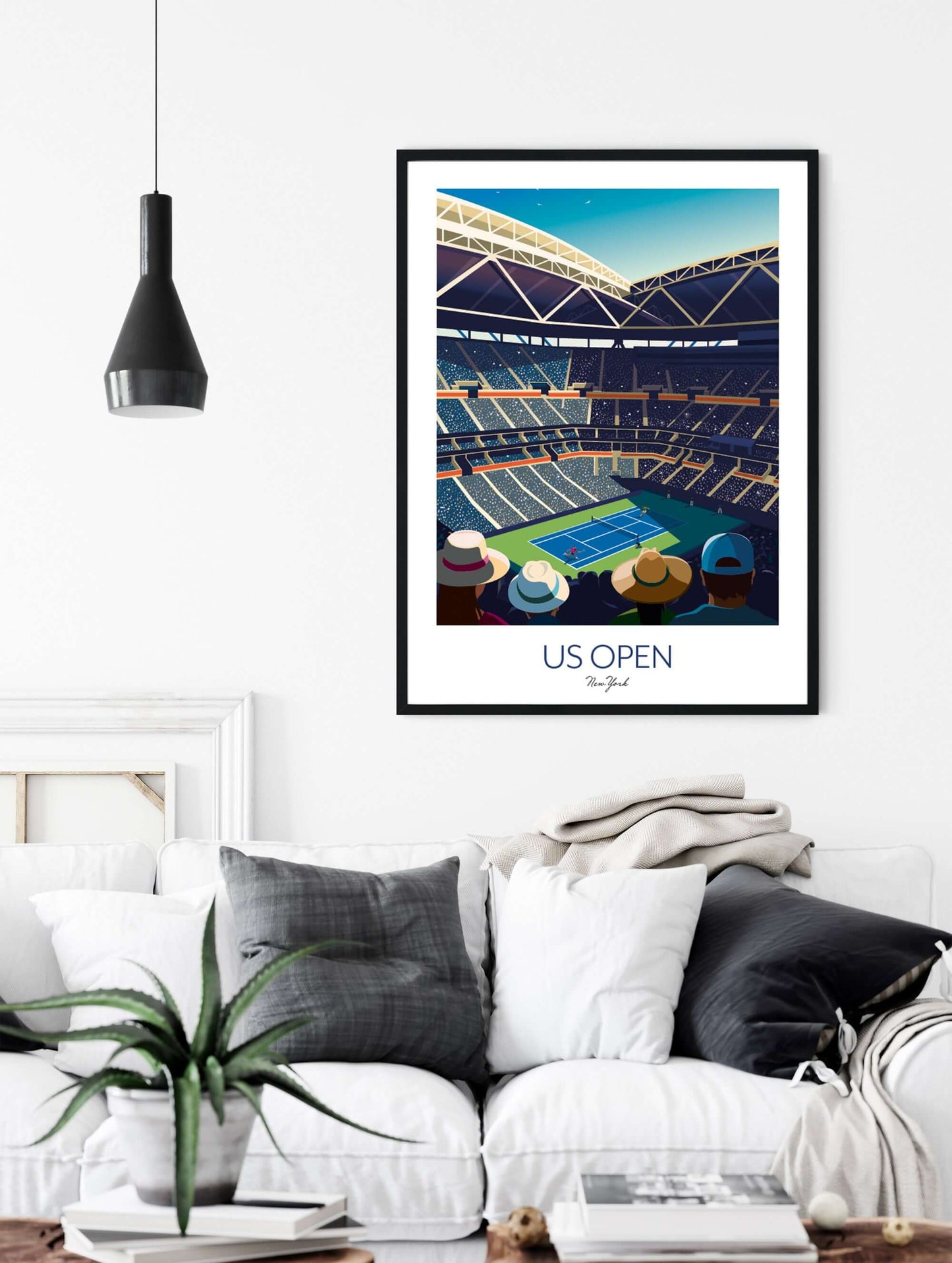 Tennis themed living room with a framed art print of US Open Grand Slam, placed on the wall above a sofa.