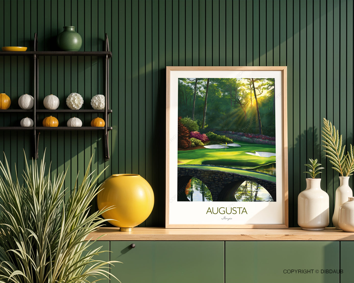 Framed artwork of Augusta National golf course on a kitchen worktop with decorative items against a green wall.