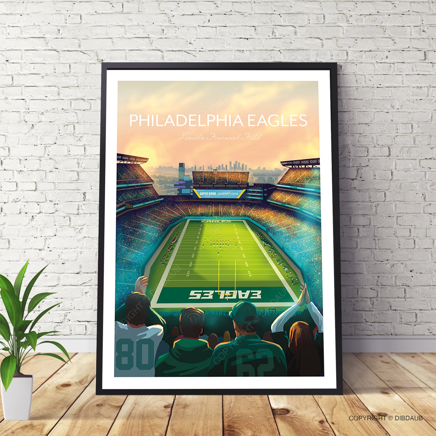 Framed Philadelphia Eagles stadium poster on a brick wall with a plant.