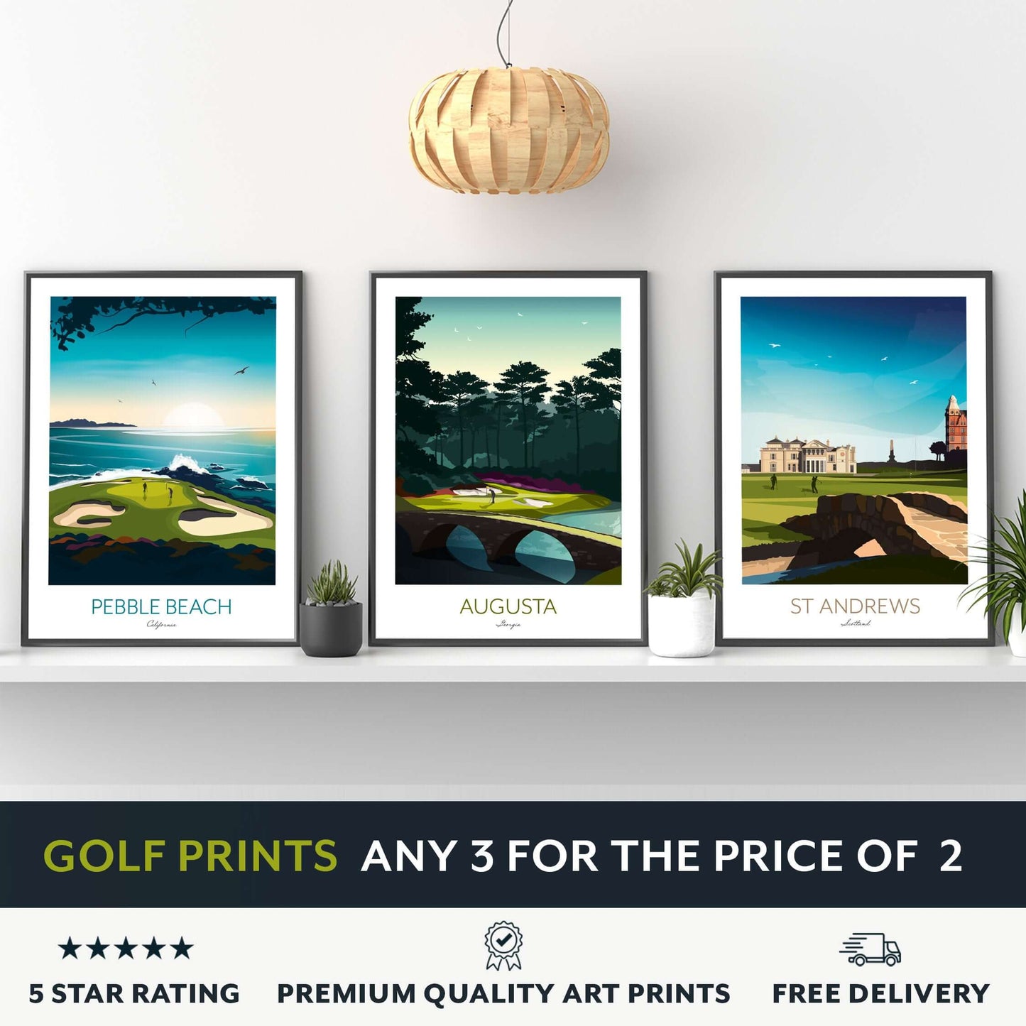 A set of 3 framed golf course prints of St Andrews, Augusta National and Pebble Beach, sitting on a shelf.