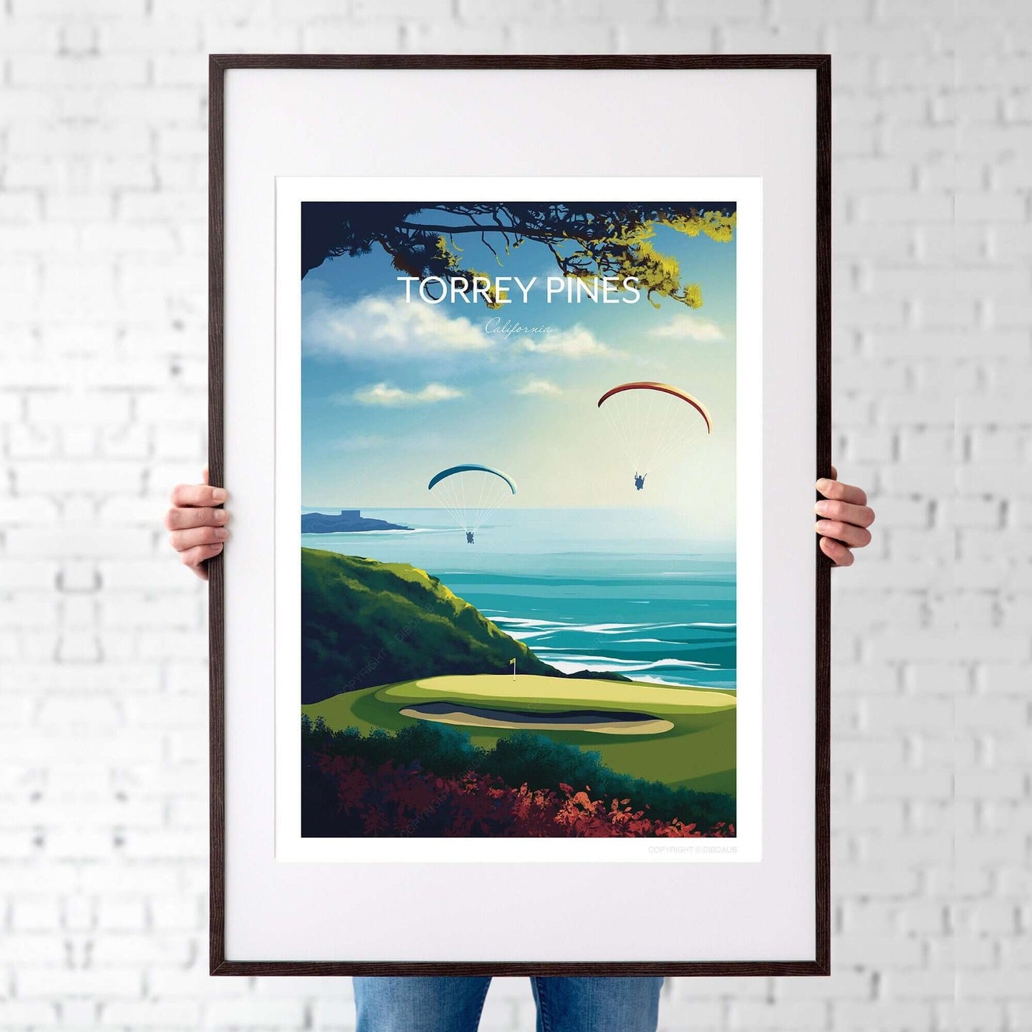 Torrey Pines golf course poster with a thin black frame, being held by a man.