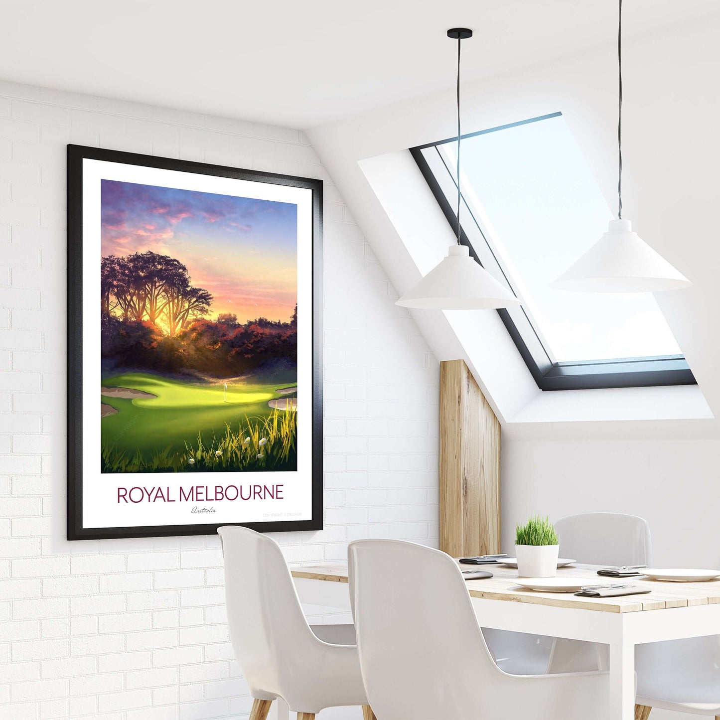 Framed golf course art print of Royal Melbourne West Course 5th hole, hanging on kitchen wall beside a dining table and Velux window.