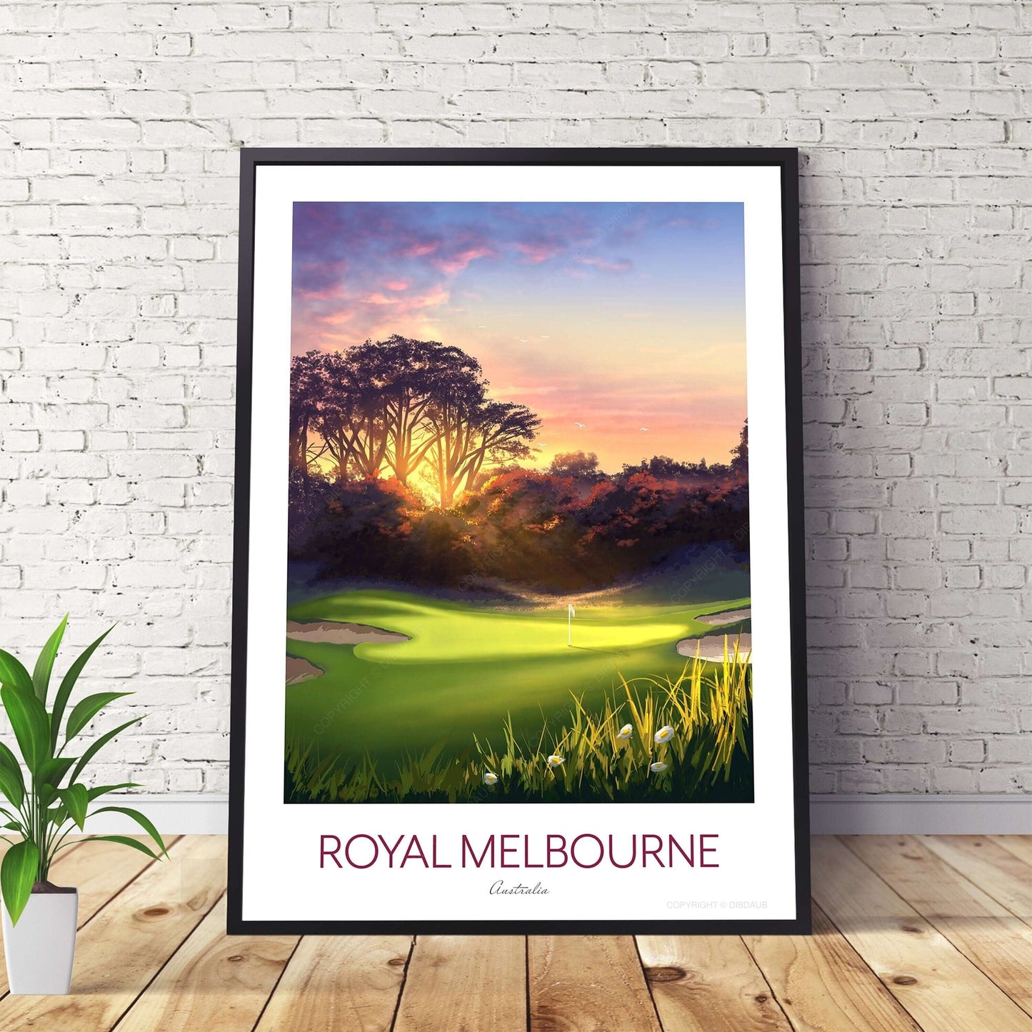 Golf poster of Royal Melbourne West Course 5th hole, in a black frame on a wooden floor.