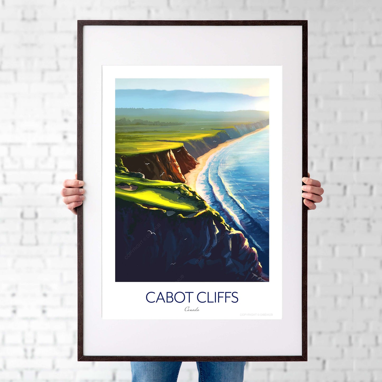 A man holding a framed golf course print of Cabot Cliffs 16th hole.