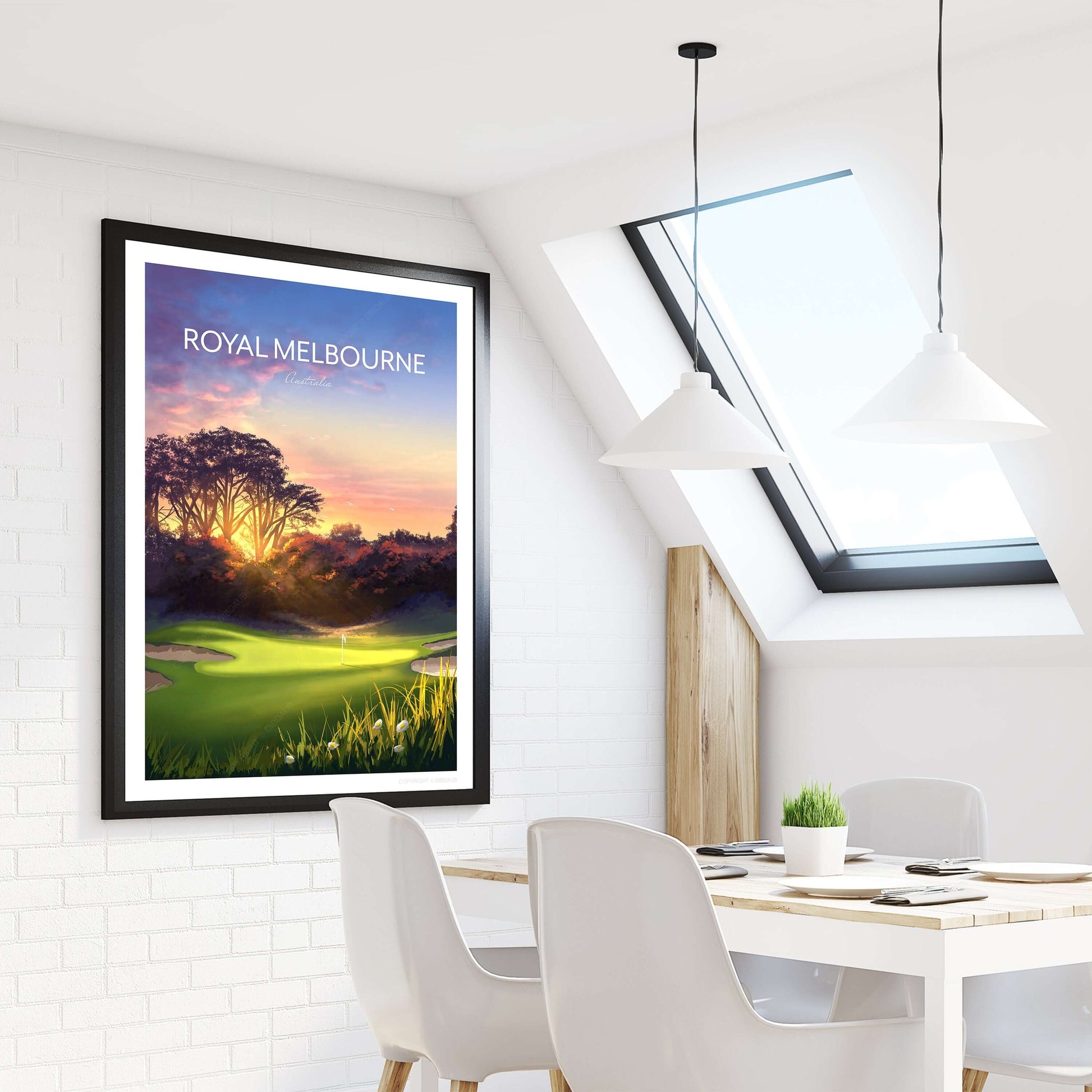 Golf poster of Royal Melbourne West Course 5th hole in a black frame, hanging on an apartment wall beside a dining table and window.